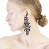 Luxury chandelier earrings made with Swarovski crystals by the model Joan Kuhlman