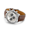 Wrist watch with brown crocodile strap with tang buckle.