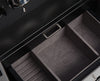 A close-up view of a storage compartment, possibly from the previously mentioned WOLF watch safe. It showcases a leather or faux leather exterior, a metallic handle on a storage drawer, and a soft velvety interior, ideal for protecting valuable items like watches or jewelry.